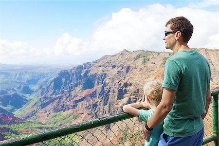 family of two enjoying waimea canyon at viewpoint, kauai island, hawaii Stock Photo - Budget Royalty-Free & Subscription, Code: 400-08318716