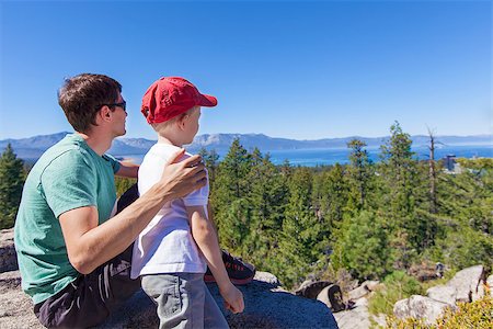 family of father and his son resting after hike and enjoying gorgeous view at lake tahoe at summer Photographie de stock - Aubaine LD & Abonnement, Code: 400-08318918