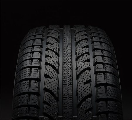 Close-up of car tire over black background Stock Photo - Budget Royalty-Free & Subscription, Code: 400-08335131