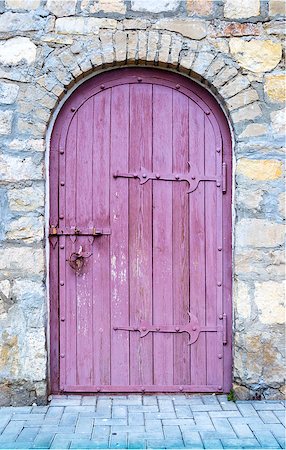 simsearch:400-07217858,k - Ancient wooden door with lock in old stone wall. Stock Photo - Budget Royalty-Free & Subscription, Code: 400-08338168