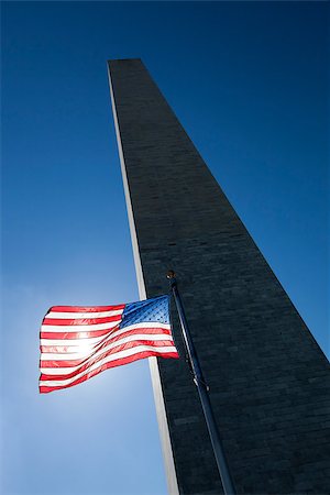 simsearch:400-06389956,k - USA flag in the wind dark sky, the sun and Washington Monument Photographie de stock - Aubaine LD & Abonnement, Code: 400-08332776