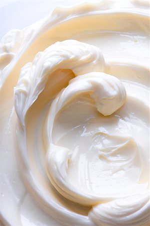 Swirling surface of light beige low-fat milky cream. Close-up photo. Stock Photo - Budget Royalty-Free & Subscription, Code: 400-08333262