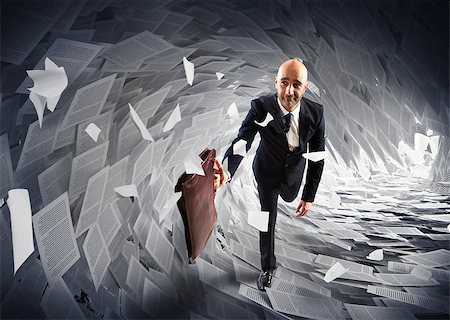 people running scared - Man runs away from a paperwork wave Stock Photo - Budget Royalty-Free & Subscription, Code: 400-08344538