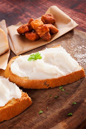 simsearch:400-04885499,k - Bread with lard and pork scratchings on brown wooden background. Traditional british eating. Stock Photo - Budget Royalty-Free & Subscription, Code: 400-08344592