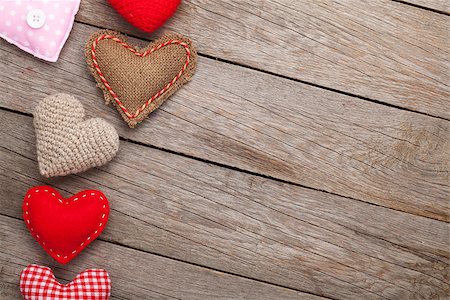 simsearch:400-07919385,k - Valentines day background with handmade toy hearts over wooden table Stock Photo - Budget Royalty-Free & Subscription, Code: 400-08346944