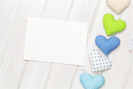 simsearch:400-07919385,k - Photo frame or greeting card and handmaded valentines day toy hearts over white wooden background Stock Photo - Budget Royalty-Free & Subscription, Code: 400-08346954