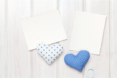 simsearch:400-07919385,k - Photo frames and handmaded valentines day toy hearts over white wooden background Stock Photo - Budget Royalty-Free & Subscription, Code: 400-08346956