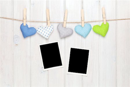 simsearch:400-07919385,k - Photo frames and valentines toy hearts over wooden background Stock Photo - Budget Royalty-Free & Subscription, Code: 400-08346957