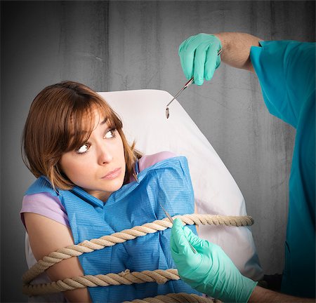 Frightened girl tied to the chair dentist Stock Photo - Budget Royalty-Free & Subscription, Code: 400-08342961