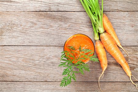 simsearch:400-06864386,k - Fresh carrot juice smoothie and roots on wooden table. Top view with copy space Stock Photo - Budget Royalty-Free & Subscription, Code: 400-08343170