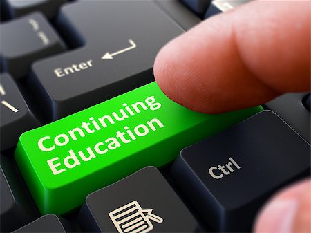 simsearch:400-06744483,k - Continuing Education - Written on Green Keyboard Key. Male Hand Presses Button on Black PC Keyboard. Closeup View. Blurred Background. Stock Photo - Budget Royalty-Free & Subscription, Code: 400-08377410