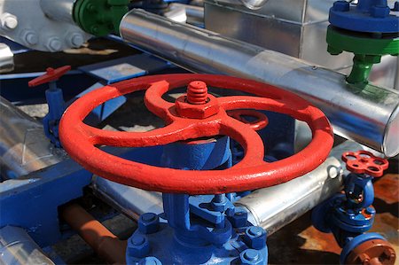 photography natural gas pipes - Red faucet with steel pipe in natural gas treatment plant in bright sunny summer day Stock Photo - Budget Royalty-Free & Subscription, Code: 400-08372379