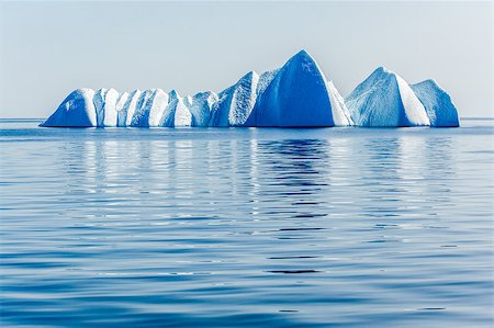 simsearch:400-05271081,k - A gathering of ice-blue bergs float silently, bearing witness in the Arctic Ocean. Photographie de stock - Aubaine LD & Abonnement, Code: 400-08372539