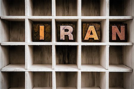 The word "IRAN" written in vintage ink stained wooden letterpress type in a partitioned printer's drawer. Stock Photo - Budget Royalty-Free & Subscription, Code: 400-08408123