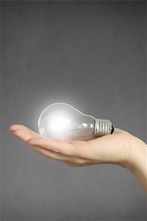 simsearch:400-04265413,k - Idea concept. Hand holding a glowing light bulb. Stock Photo - Budget Royalty-Free & Subscription, Code: 400-08409936