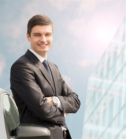 simsearch:694-03557971,k - Handsome young businessman standing near his car Stock Photo - Budget Royalty-Free & Subscription, Code: 400-08403983