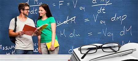 physics icons - Students reading in the library against blue chalkboard Stock Photo - Budget Royalty-Free & Subscription, Code: 400-08414188