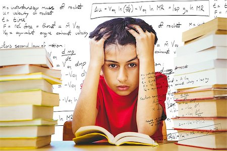 Tensed boy sitting with stack of books against rocket science theory Stock Photo - Budget Royalty-Free & Subscription, Code: 400-08414438