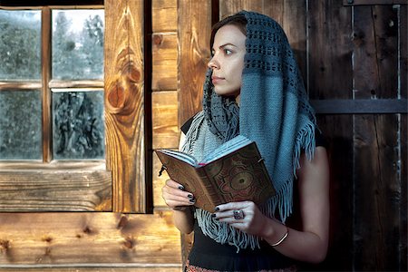 casual woman reading a book against wooden plank Stock Photo - Budget Royalty-Free & Subscription, Code: 400-08410949