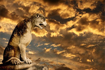 simsearch:400-05716374,k - Beautiful sunset, ancient lion statue and storm sky Stock Photo - Budget Royalty-Free & Subscription, Code: 400-08412330
