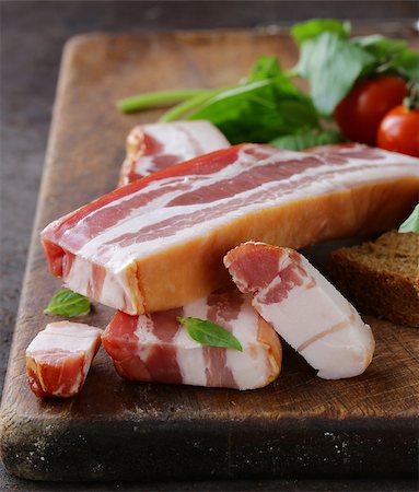 simsearch:400-04885499,k - smoked bacon with basil and tomatoes on a cutting board Stock Photo - Budget Royalty-Free & Subscription, Code: 400-08427750