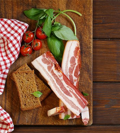 simsearch:400-04885499,k - smoked bacon with basil and tomatoes on a cutting board Stock Photo - Budget Royalty-Free & Subscription, Code: 400-08427752