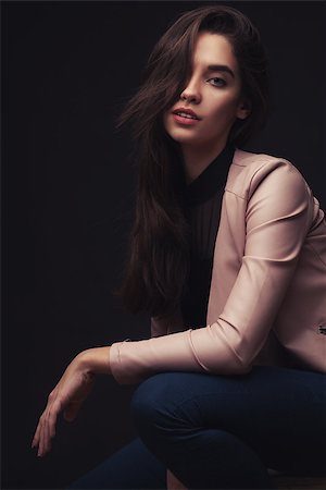 simsearch:400-04135676,k - portrait of pretty young brunette lady in pink suit on dark studio background Stock Photo - Budget Royalty-Free & Subscription, Code: 400-08427917