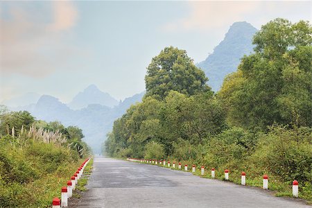 road to paradise - tropical road in jungle with a scenic view of Cat Ba island, Vietnam Stock Photo - Budget Royalty-Free & Subscription, Code: 400-08429008