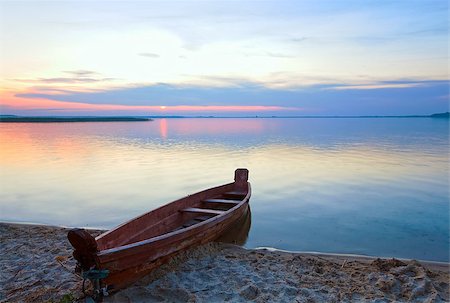 Sunset and old wooden fishing boat near the summer lake shore (Svityaz, Ukraine) Stock Photo - Budget Royalty-Free & Subscription, Code: 400-08430464