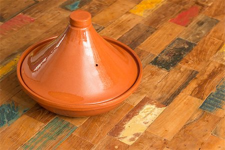 Moroccan brown tagine on a colorful table Stock Photo - Budget Royalty-Free & Subscription, Code: 400-08431280