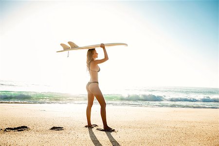 simsearch:400-07421488,k - Beautiful young surfer girl holding a surfboard Stock Photo - Budget Royalty-Free & Subscription, Code: 400-08432413