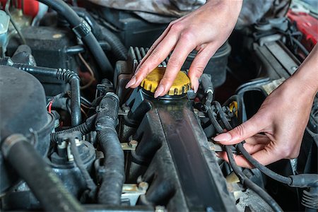 Young female car mechanic in auto repair service, red automobile, long fingernail Stock Photo - Budget Royalty-Free & Subscription, Code: 400-08432514