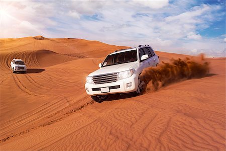 dune driving - Desert Safari SUVs bashing through the arabian sand dunes Stock Photo - Budget Royalty-Free & Subscription, Code: 400-08433934