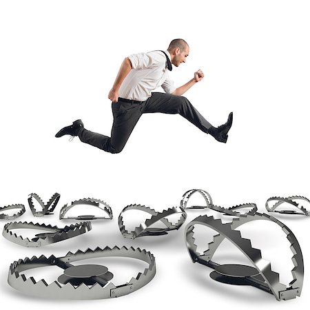 people running scared - Man runs quickly to overcome the traps Stock Photo - Budget Royalty-Free & Subscription, Code: 400-08499039
