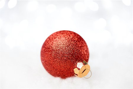 simsearch:400-05693036,k - Christmas Decoration with Red Ball in the Snow on the Blurred Background with Holiday Lights. Greeting Card with Space for Your Text Stock Photo - Budget Royalty-Free & Subscription, Code: 400-08492624