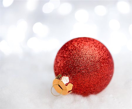 simsearch:400-05693036,k - Christmas Decoration with Red Ball in the Snow on the Blurred Background with Holiday Lights. Greeting Card with Space for Your Text Stock Photo - Budget Royalty-Free & Subscription, Code: 400-08492623