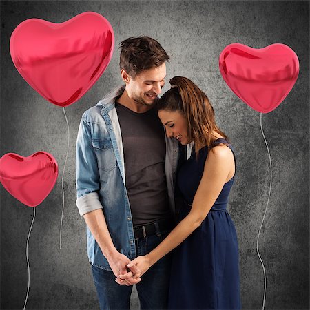 Smiling couple embracing with red heart balloons Stock Photo - Budget Royalty-Free & Subscription, Code: 400-08504647