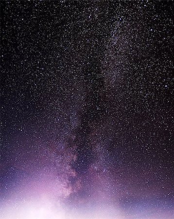 Part of a night sky with stars and Milky Way over violet clouds Stock Photo - Budget Royalty-Free & Subscription, Code: 400-08529131