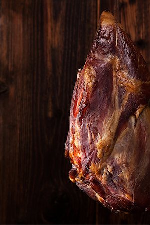 simsearch:400-04885499,k - Traditional smoked meat hanging against wooden background. Culinary meat eating. Stock Photo - Budget Royalty-Free & Subscription, Code: 400-08533209