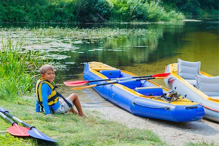 simsearch:400-05308802,k - Active boy resting after adventurous experience kayaking on the river on a sunny day during summer vacation Stock Photo - Budget Royalty-Free & Subscription, Code: 400-08574066