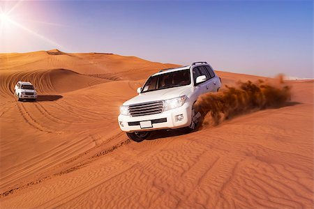 dune driving - Desert Safari SUVs bashing through the arabian sand dunes Stock Photo - Budget Royalty-Free & Subscription, Code: 400-08572928