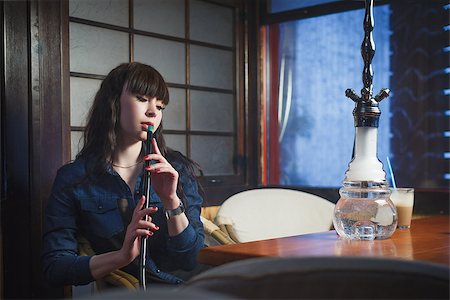 Concept: leisure lifestyle. Beautiful young woman with hookah in a bar restaurant Stock Photo - Budget Royalty-Free & Subscription, Code: 400-08614278