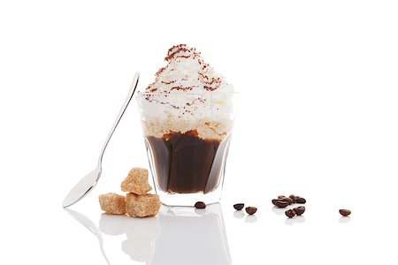Viennese coffee. Espressoo coffe toped with whipped cream and sprinkled with chocolated with coffee beans, brown sugar and spoon isolated on white background. Stock Photo - Budget Royalty-Free & Subscription, Code: 400-08620342