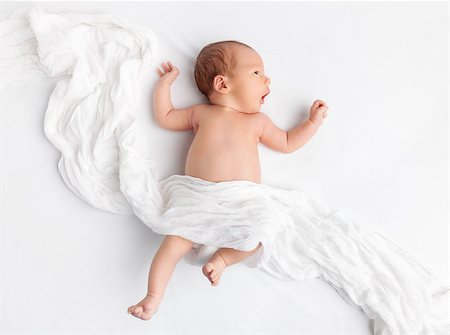 Cute newborn baby lying on bed under a blanket Stock Photo - Budget Royalty-Free & Subscription, Code: 400-08668736