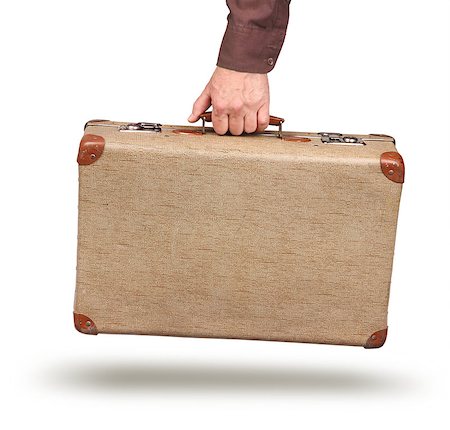 Male hand holding old vintage suitcase isolated on white Stock Photo - Budget Royalty-Free & Subscription, Code: 400-08695624