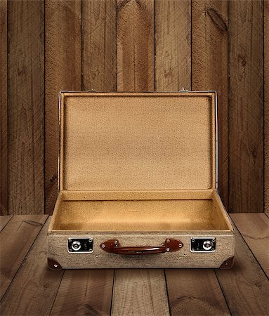 empty suitcase - Vintage suitcase opened on rough wooden plank background Stock Photo - Budget Royalty-Free & Subscription, Code: 400-08695627