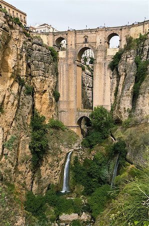 The Puente Nuevo (New Bridge) is largest bridges that span the 120-metre deep chasm that divides the city of Ronda, Spain. In was build in 1793 Stock Photo - Budget Royalty-Free & Subscription, Code: 400-08695646