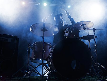 simsearch:400-04863651,k - Silhouette drummer on stage. Dark background, smoke spotlights Stock Photo - Budget Royalty-Free & Subscription, Code: 400-08729951