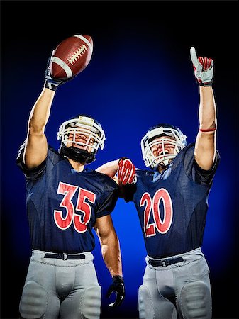 two american football players men isolated on colorful black background Foto de stock - Super Valor sin royalties y Suscripción, Código: 400-08735663