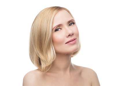 Beautiful middle aged woman with smooth skin and short blond hair. Beauty shot. Isolated over white background. Copy space. Photographie de stock - Aubaine LD & Abonnement, Code: 400-08731479